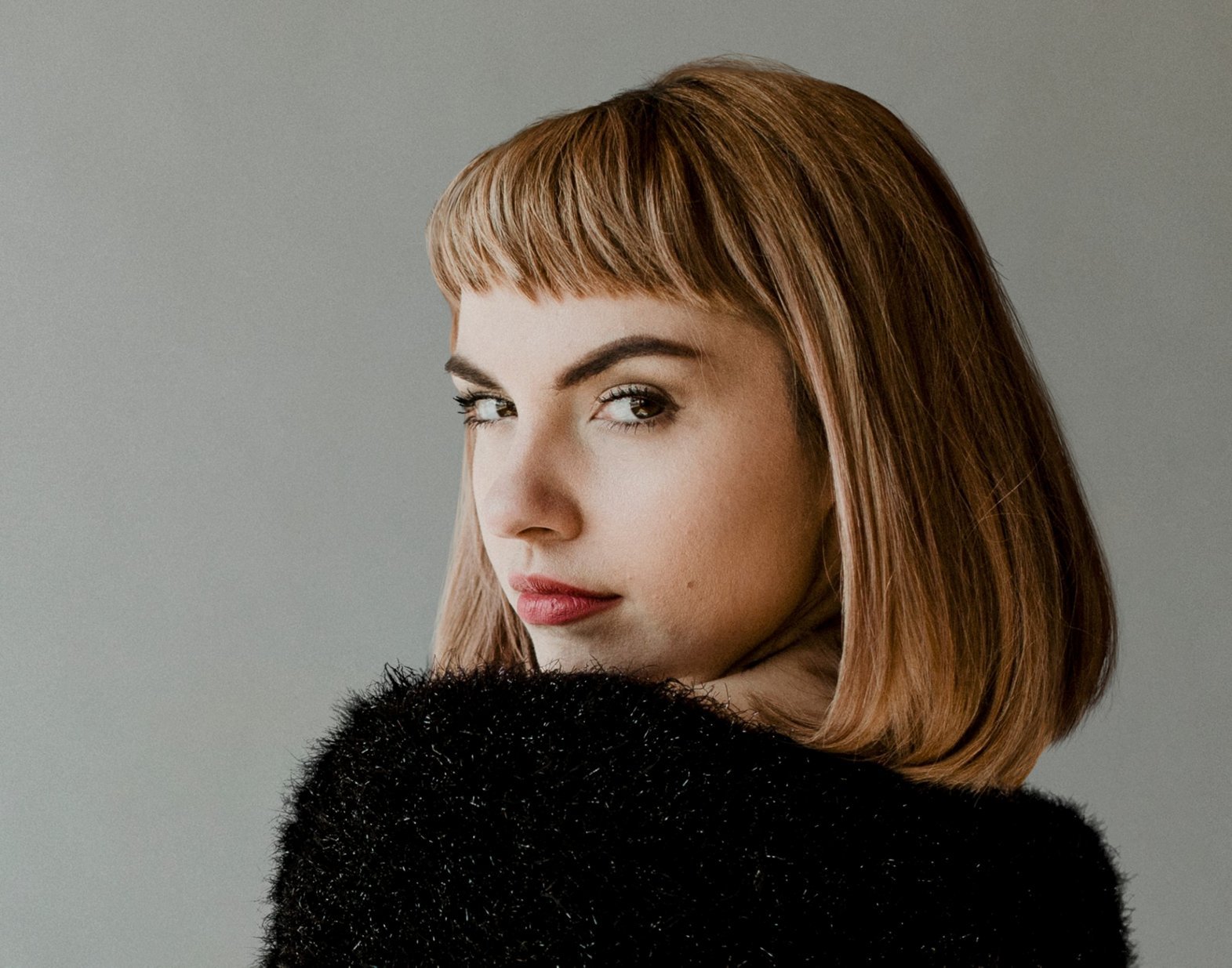 Blonde with a volumised bob and a fringe