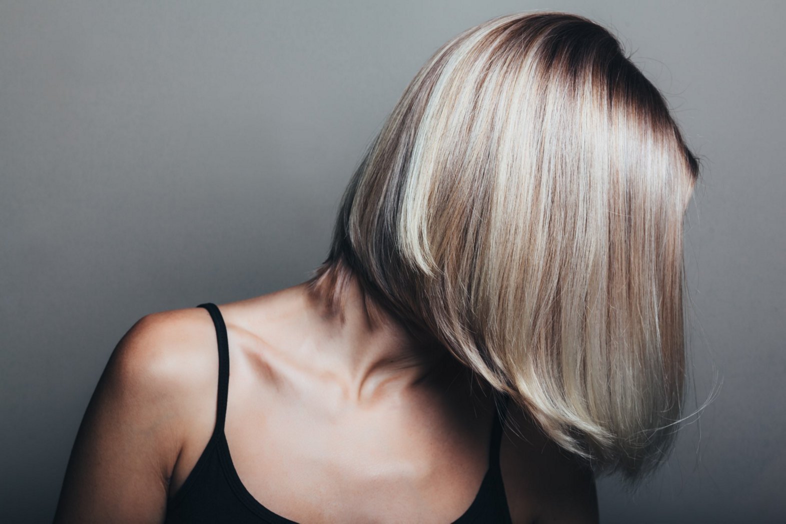 Blonde women with blunt-cut asymmetric bob