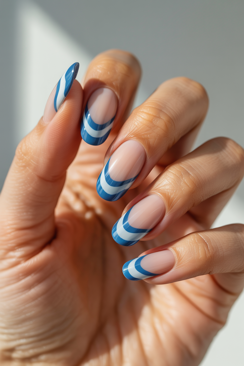 Layered Wave Tips nail design — Two or three stacked wavy lines at the tip in graduating shades of blue and white.