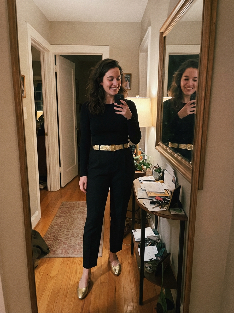 All-black outfit with a metallic belt New Year’s Eve outfit