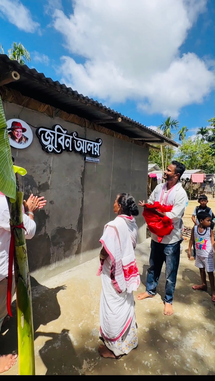The Zubeen Aloy nameplate being unveiled on a newly built house in Sivasagar